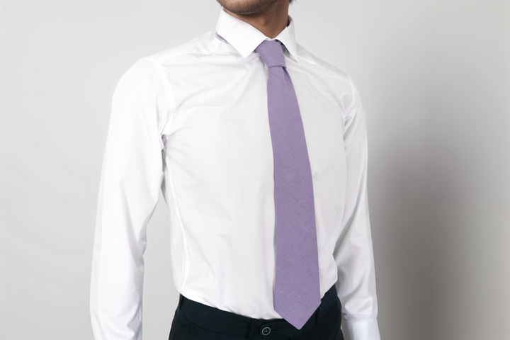 Man wearing Menlau Elegant Linen Lavender Necktie paired with a white dress shirt.