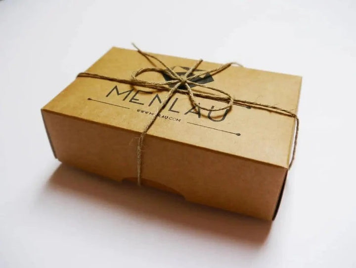 a box wrapped in brown paper and tied with a string