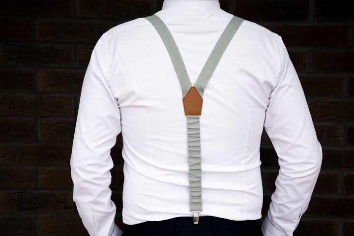 a man wearing a white shirt with a brown tie