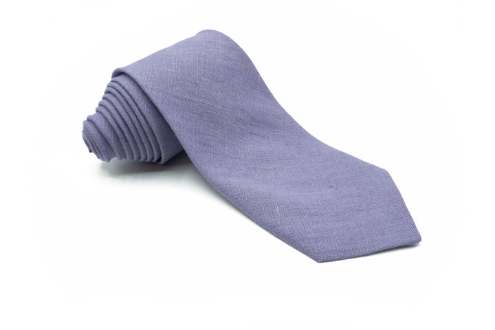 Menlau Elegant Linen Lavender Necktie partially unrolled and laid flat on a white background.