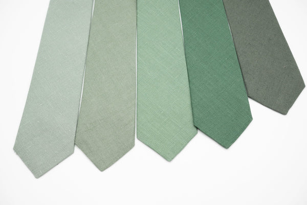a group of five different colors of ties
