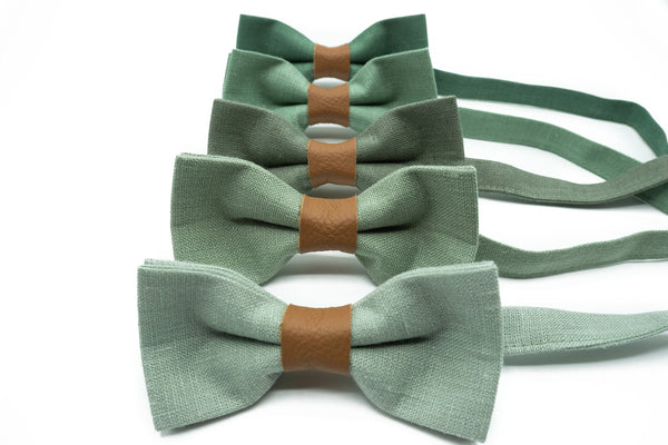 Set of three sage green bow ties with leather centers displayed on a white background.