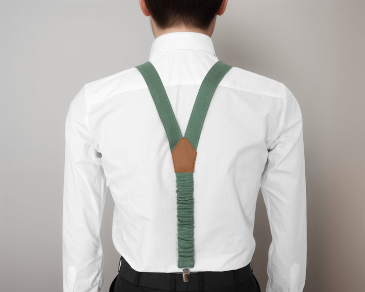 Man in white shirt showcasing adjustable sage green linen suspenders and matching bow tie, perfect for formal attire.